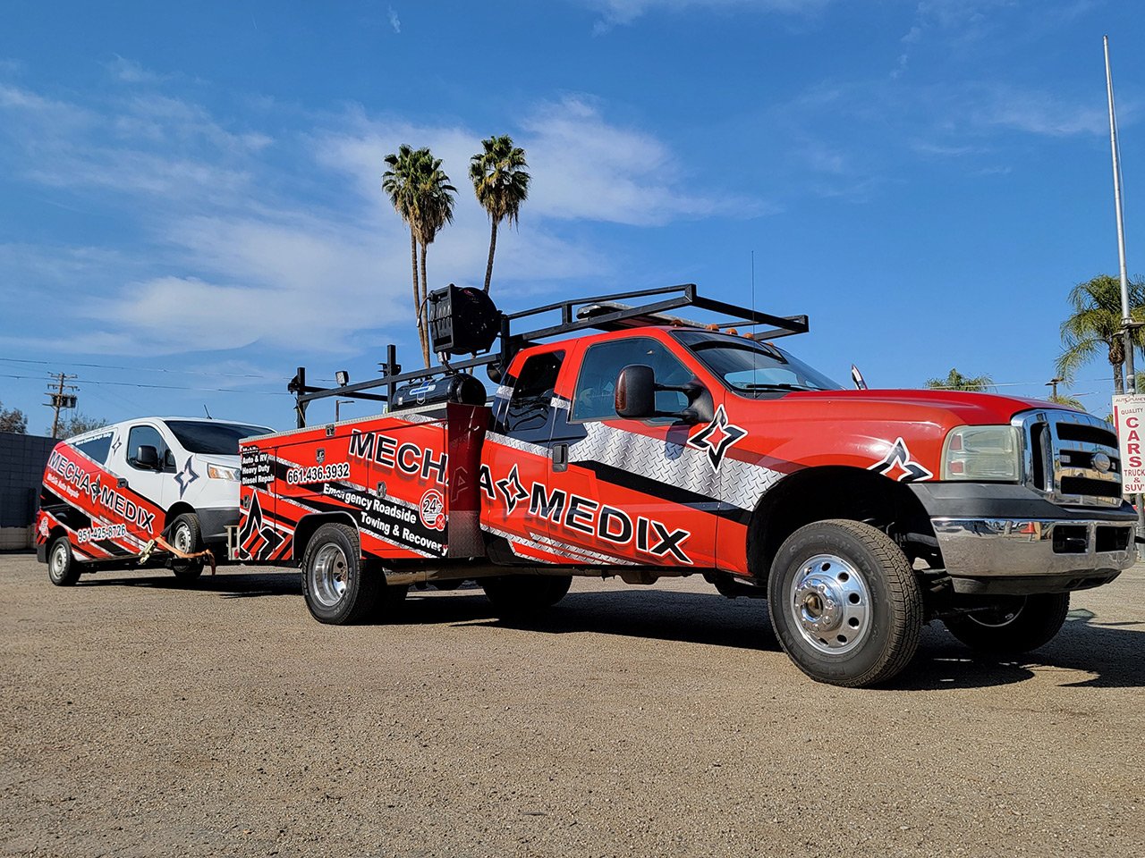 The MechaMedix Bakersfield tow truck towing our new Riverside mobile mechanic van.