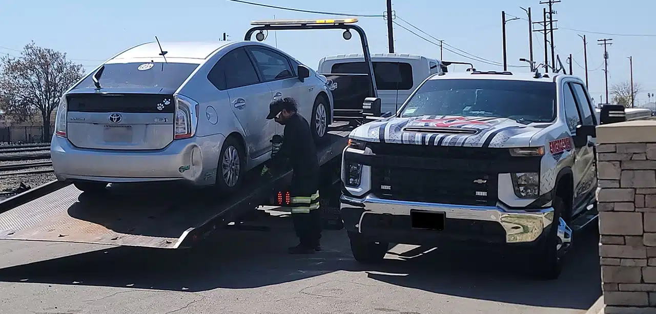 A MechaMedix repair truck towing a vehicle